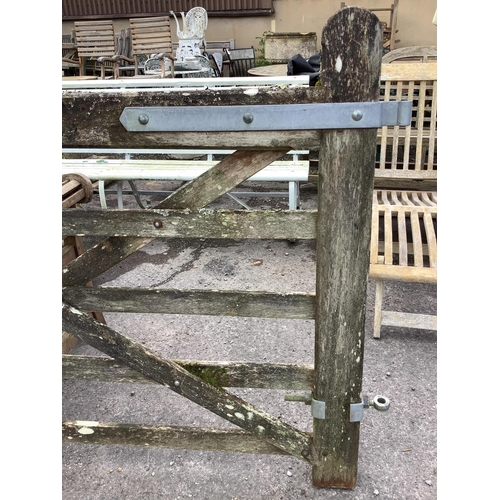 1032 - A pair of 10ft Biddenden hardwood gates with galvanised mounts. Condition - fair