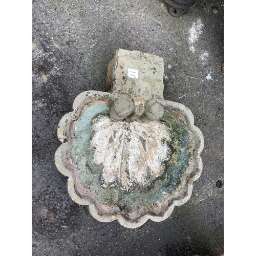 1040 - A rose marble shell font, width 50cm, depth 57cm. Condition - good