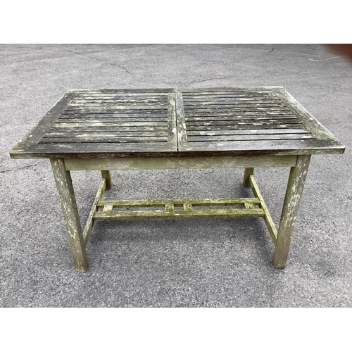 1041 - A Westminster rectangular weathered teak extending garden table, width 140cm, depth 90cm, height 73c... 