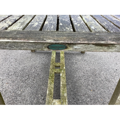 1041 - A Westminster rectangular weathered teak extending garden table, width 140cm, depth 90cm, height 73c... 