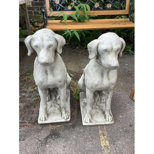 1047 - A pair of reconstituted stone seated hound garden ornaments, height 71cm. Condition - good