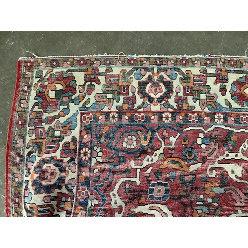 1059 - A North West Persian brick red ground rug, 200 x 148cm. Condition - fair