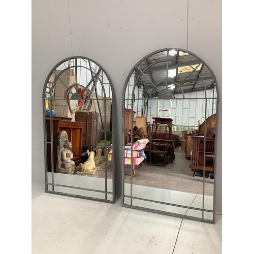 1068 - A pair of wrought iron framed window style garden mirrors, each width 90cm, height 156cm.  Condition... 