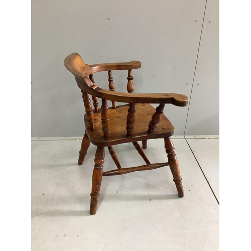 1084 - A Victorian elm and beech smoker's bow chair, width 65cm, depth 46cm, height 77cm.  Condition - fair... 