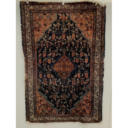 1123 - A North West Persian blue ground rug, 194 x 130cm. Condition - fair