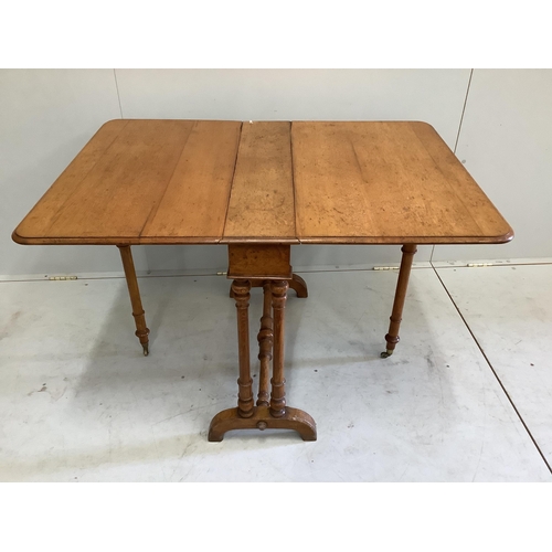 1128 - A late Victorian Howard and Sons oak Sutherland table, width 76cm, depth 18cm, height 68cm. Conditio... 