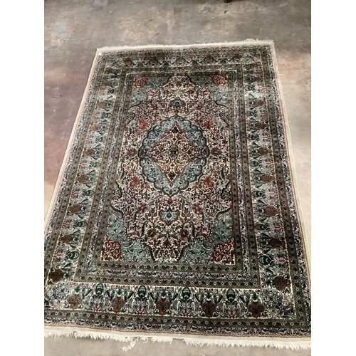 1157 - A Persian design ivory ground rug, 272 x 182cm. Condition - fair