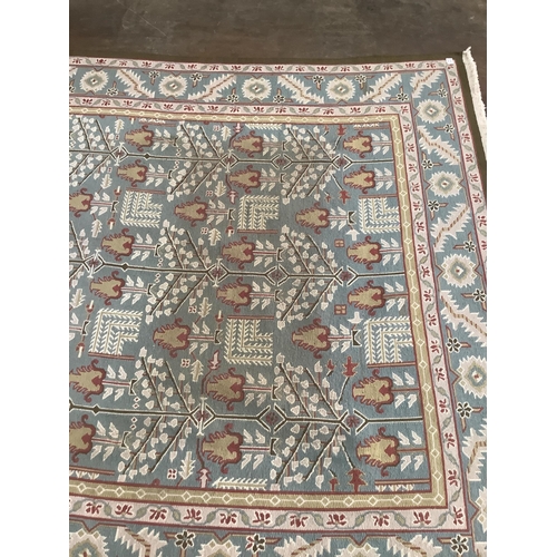 1160 - A modern Caucasian style pale blue ground carpet, 370 x 242cm. Condition - fair