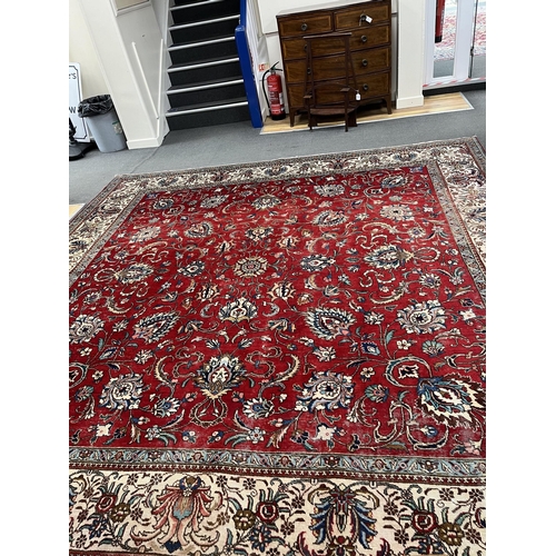 1212 - A Persian red ground carpet, worn, 340 x 340cm. Condition - fair