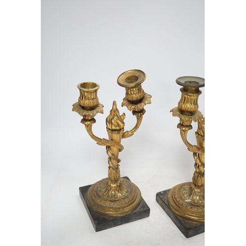 1251 - A pair of 19th century Louis XVI style gilt metal twin branch candelabra, 27cm. Condition - poor to ... 