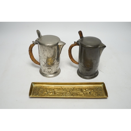 1254 - Archibald Knox (1864-1933) for Liberty & Co, two Tudric hot water jugs and an Art Nouveau brass pen ... 