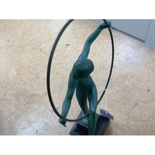 1277 - An Art Deco spelter model of a hoop dancer, signed Briand, 29cm. Condition - fair to good