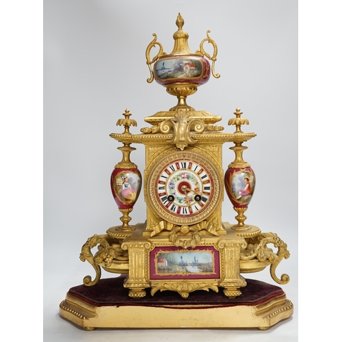 1283 - A late 19th century gilt spelter and porcelain mantel clock with two stands, a case, key and pendulu... 