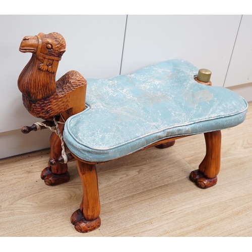 1287 - A carved wood foot stool in the form of a camel, blue stamped patterned leather cushion, 56cm high, ... 