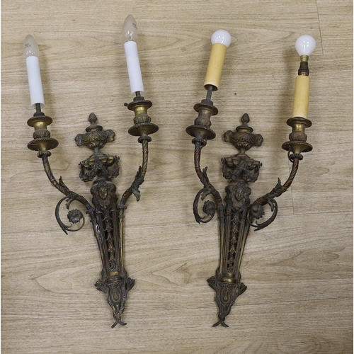 1292 - A pair of Louis XVI style cast brass two branch wall lights, 60cm high including fittings. Condition... 