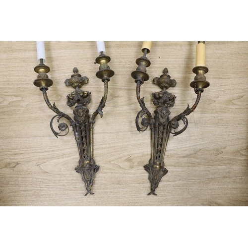 1292 - A pair of Louis XVI style cast brass two branch wall lights, 60cm high including fittings. Condition... 