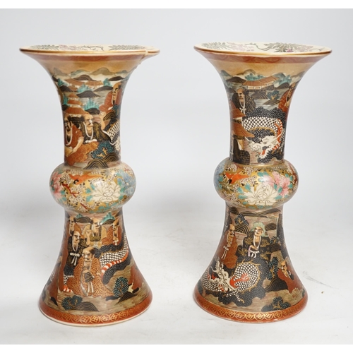 1308 - A pair of Japanese satsuma pottery 'rakan' vases, Meiji period, 24.5cm high (one a.f.). Condition - ... 