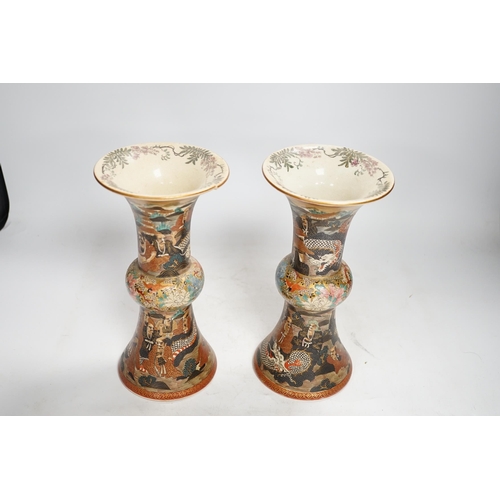 1308 - A pair of Japanese satsuma pottery 'rakan' vases, Meiji period, 24.5cm high (one a.f.). Condition - ... 