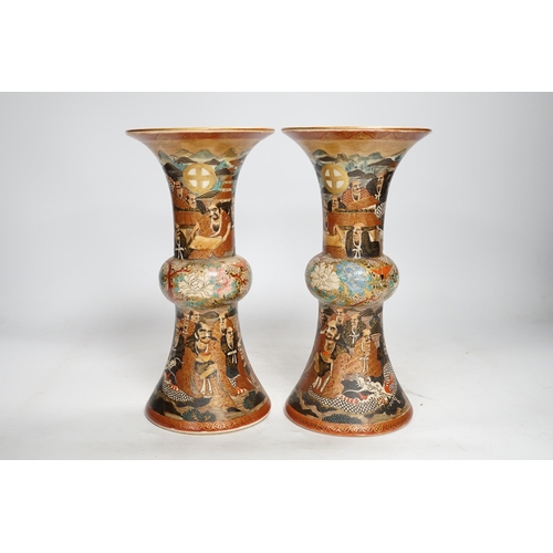 1308 - A pair of Japanese satsuma pottery 'rakan' vases, Meiji period, 24.5cm high (one a.f.). Condition - ... 