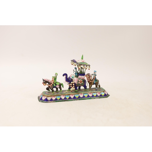 1314 - An Indian enamelled white metal model of an elephant parade, with a stamped floral decorated base, s... 