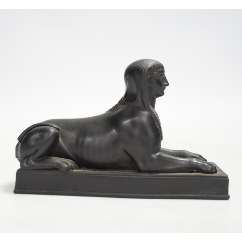 1319 - A 19th century Wedgwood basalt model of a sphinx. Condition - loss to tail, minor rubbing, fair... 