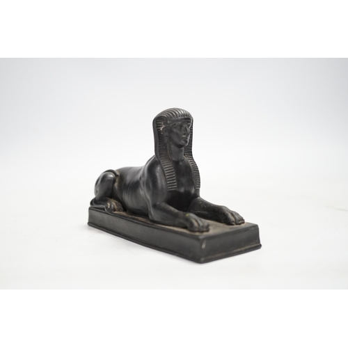 1319 - A 19th century Wedgwood basalt model of a sphinx. Condition - loss to tail, minor rubbing, fair... 