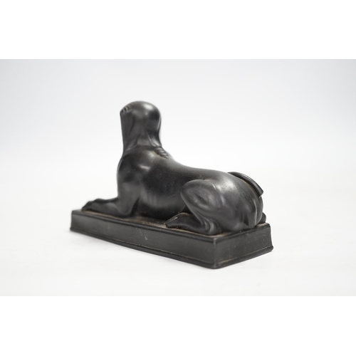 1319 - A 19th century Wedgwood basalt model of a sphinx. Condition - loss to tail, minor rubbing, fair... 