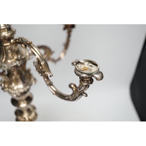 1321 - A large silver plated candelabrum. Condition - one candle holder broken, overall poor