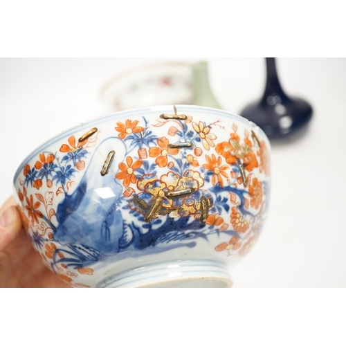 1325 - A Chinese famille rose bowl, an Imari patterned bowl, a small blue glazed vase and a similar celadon... 