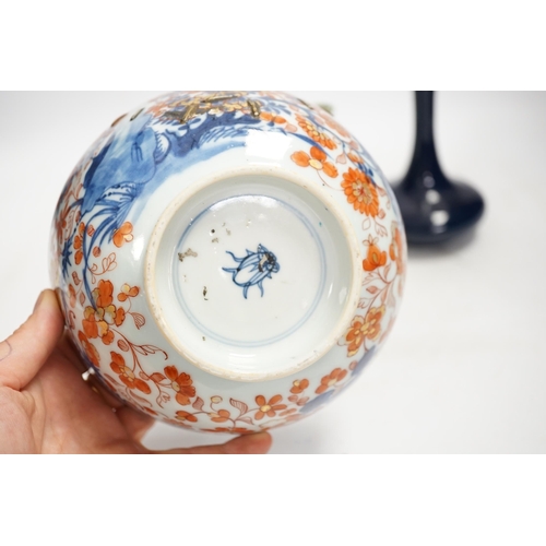 1325 - A Chinese famille rose bowl, an Imari patterned bowl, a small blue glazed vase and a similar celadon... 