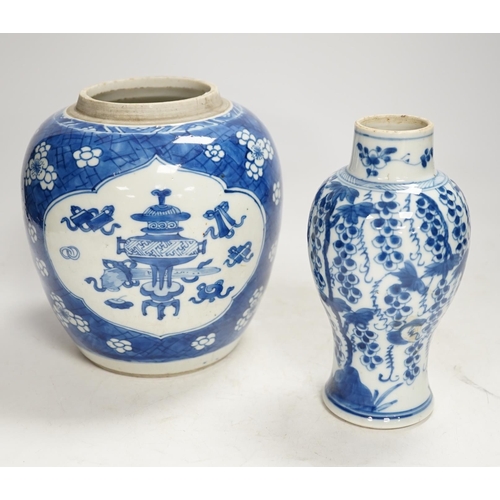 1327 - A Chinese Kangxi blue and white jar and a similar vase, jar 19.5cm high. Condition - both cracked an... 