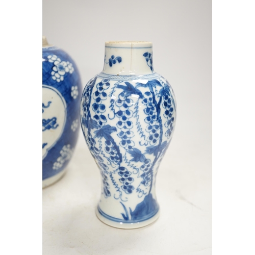 1327 - A Chinese Kangxi blue and white jar and a similar vase, jar 19.5cm high. Condition - both cracked an... 