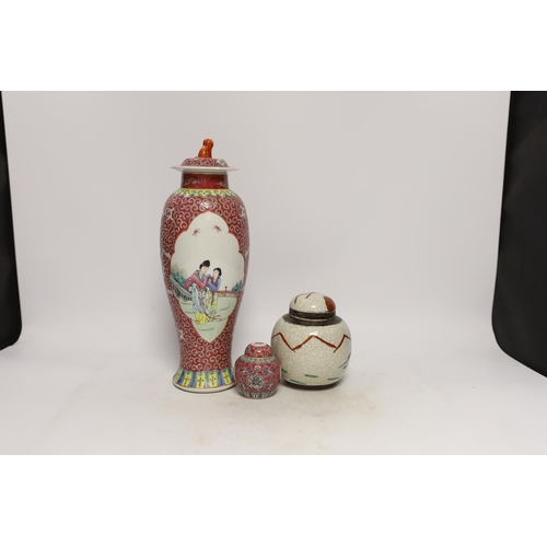 1337 - An early 20th century Chinese famille rose vase and cover, a similar small jar and cover and a famil... 