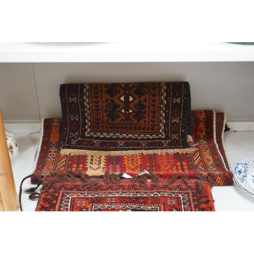 1342 - A saddle bag and two prayer rugs. Condition - fair