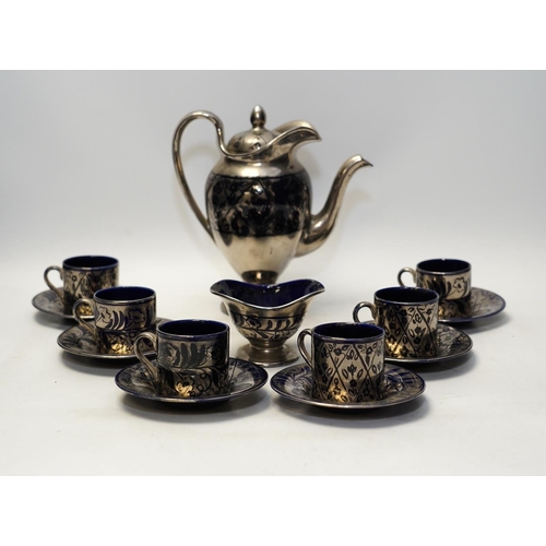 1379 - Charlotte Rhead, a Bursley ware thirteen piece coffee set, silver resist. 20cm. Condition - fair... 