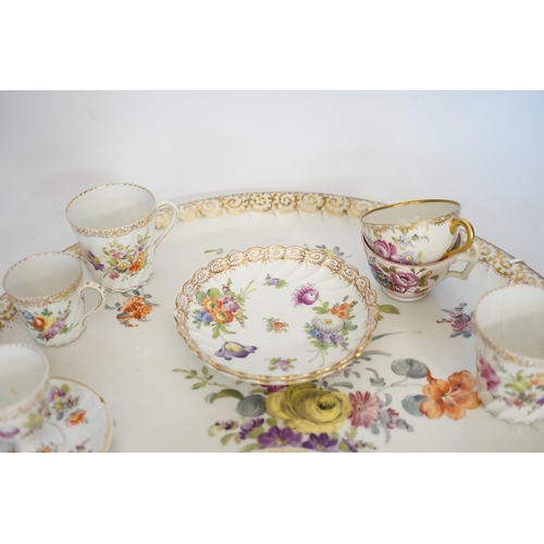 1386 - A Dresden floral painted tray and other coffee wares, 39cm diameter. Condition - poor to fair