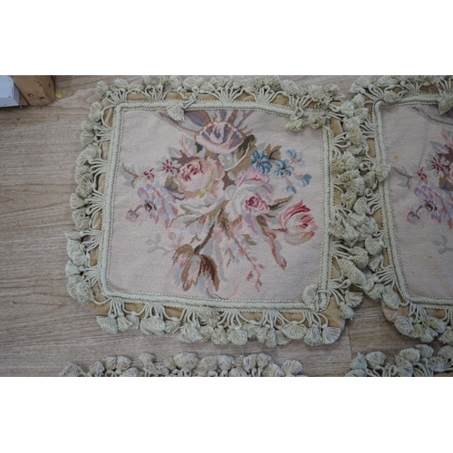 1402 - Three small square rose designed wool worked cushion covers and one similar larger cushion cover all... 