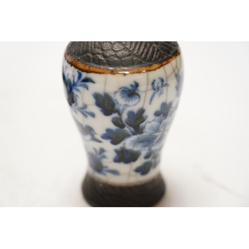 1411 - Chinese blue and white ceramics comprising crackle glaze vases and circular seal pots (4). Condition... 