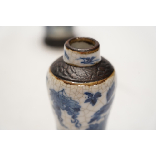 1411 - Chinese blue and white ceramics comprising crackle glaze vases and circular seal pots (4). Condition... 