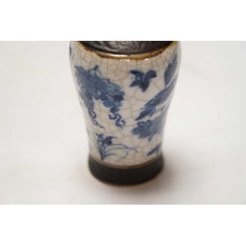 1411 - Chinese blue and white ceramics comprising crackle glaze vases and circular seal pots (4). Condition... 