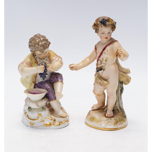 1412 - Two Meissen porcelain figures, boys with grapes, largest 13cm high. Condition - poor