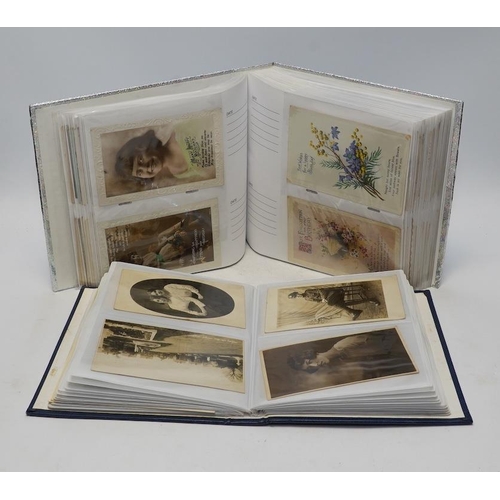 1417 - Two albums of Edwardian and later topographical and humorous postcards. Condition - good