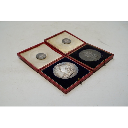 1419 - Two Victoria 1897 Diamond Jubilee commemorative silver medals, cased, and two smaller silver medals.... 