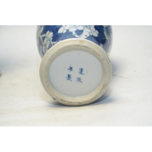 1440 - A pair of Chinese blue and white prunus baluster vases and covers, 31cm high. Condition - one vase g... 