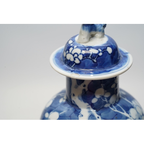 1440 - A pair of Chinese blue and white prunus baluster vases and covers, 31cm high. Condition - one vase g... 