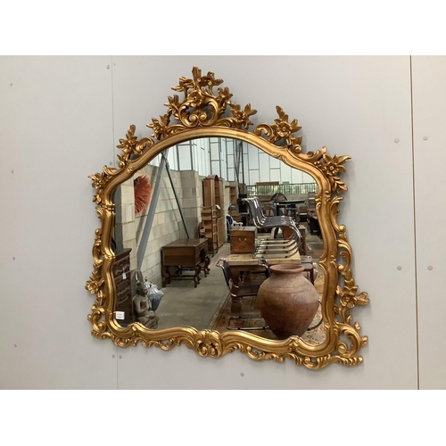 119 - A Victorian style composition gilt framed wall mirror, width 120cm. Condition good