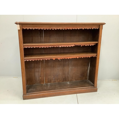 12 - An Edwardian oak open bookcase, width 152cm, depth 40cm, height 137cm. Condition - poor