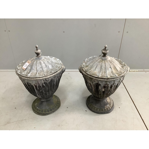 120 - A pair of 19th century lead urns and covers, height 52cm. Condition - fair