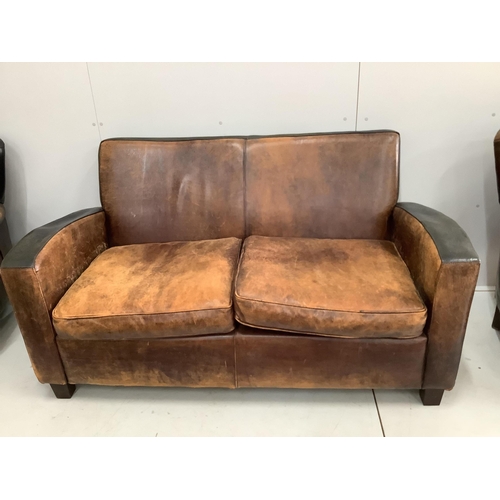 13 - A leather settee, width 156cm, depth 78cm, height 82cm and a pair of leather wing armchairs.  Condit... 