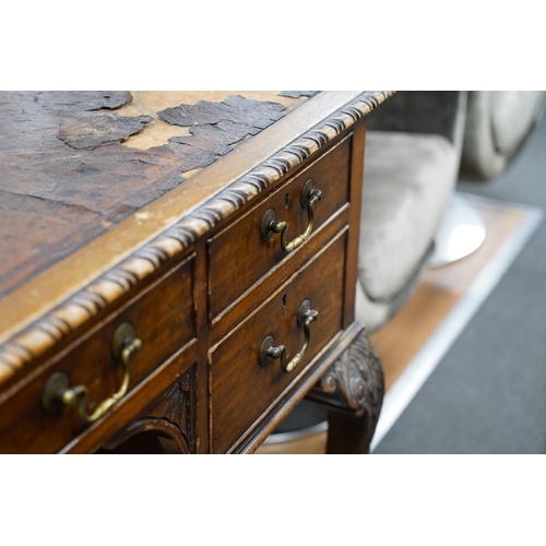 139 - An early 20th century Chippendale Revival mahogany kneehole writing table, width 136cm, depth 75cm, ... 